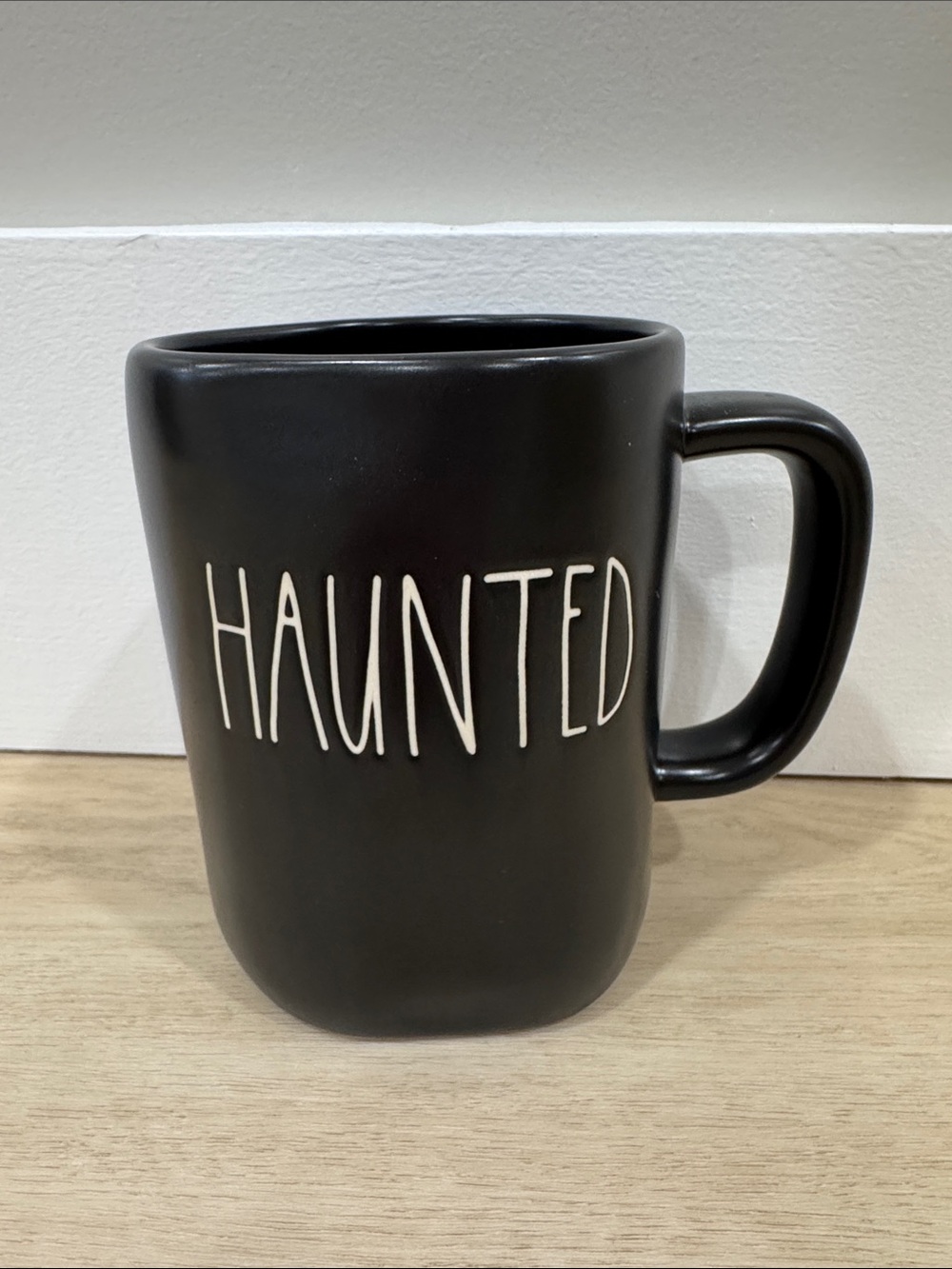 Rae Dunn Black Mug with White 'HAUNTED'